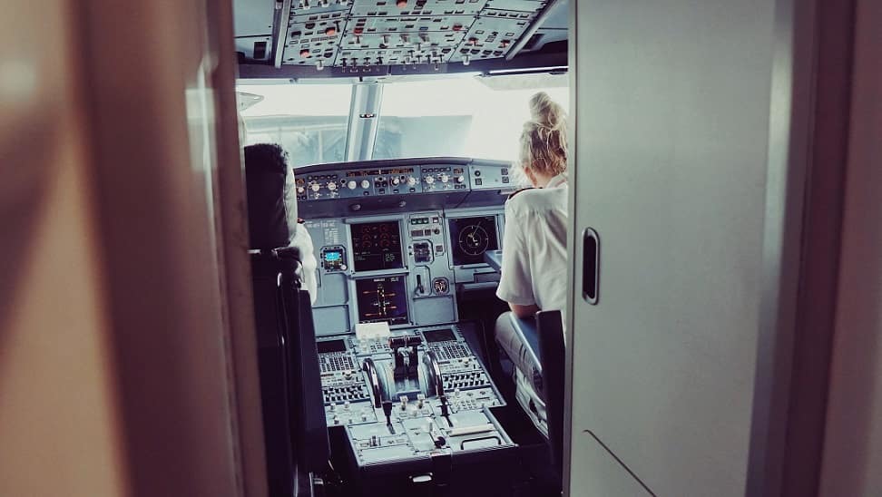 Female airline pilot in the cockpit