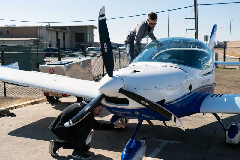 flight instructor and student doing preflight check