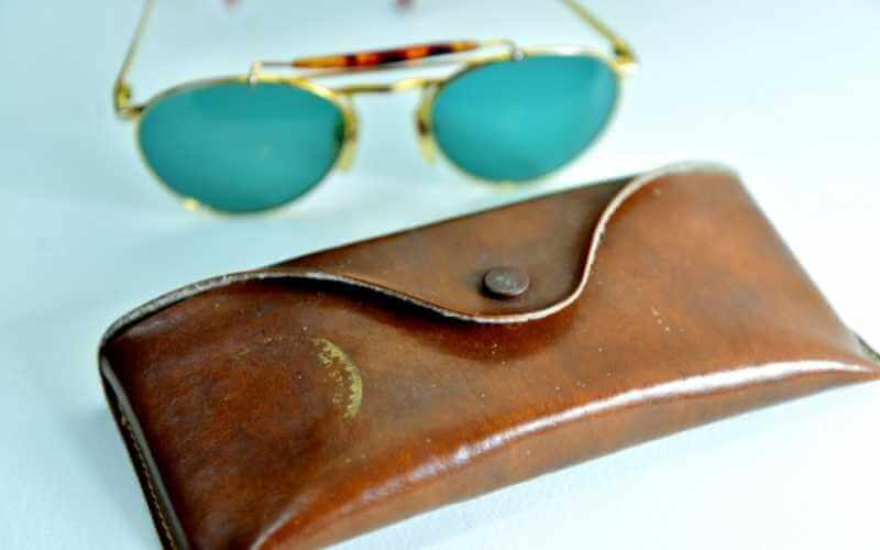 This pilot is wearing sunglasses while flying an aircraft.