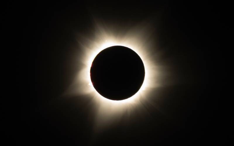 Flying in an eclipse