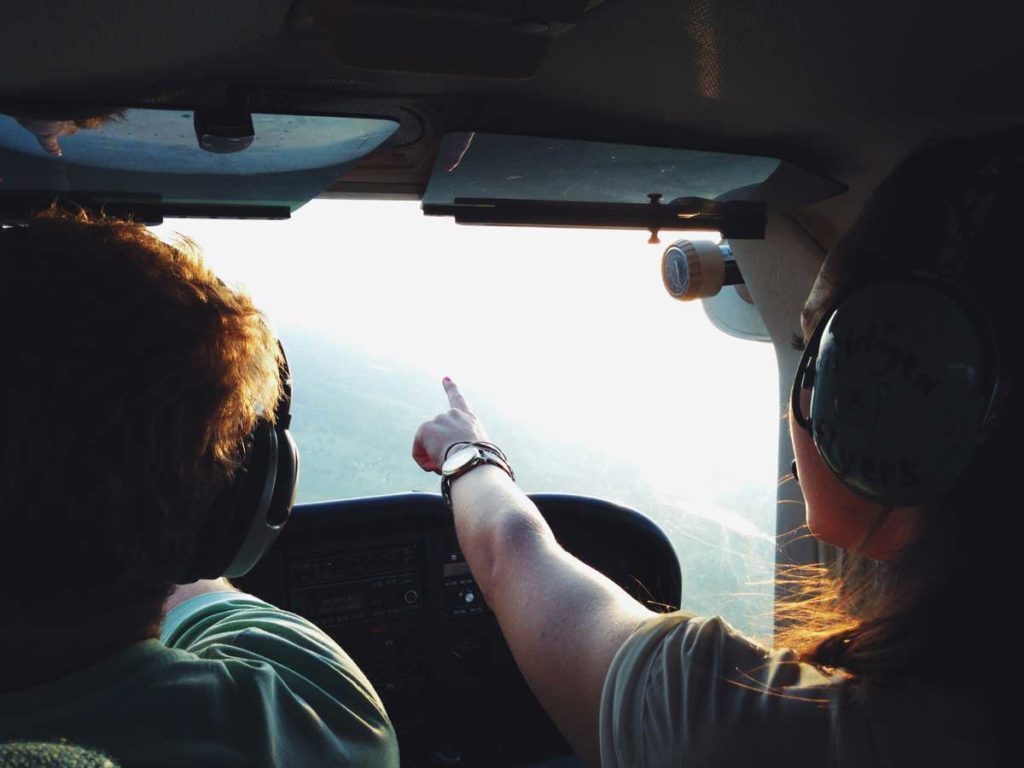 Flight instructor and students in helicopter