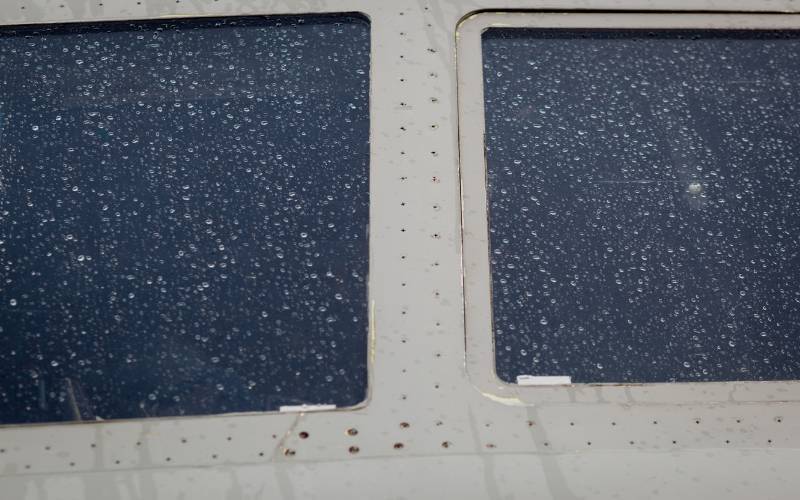 airplane windows covered in rain
