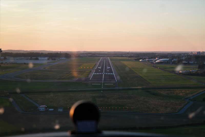 Small plane landing with clear skies