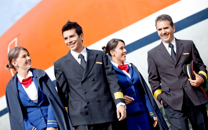 Pilots walking who are senior and junior.