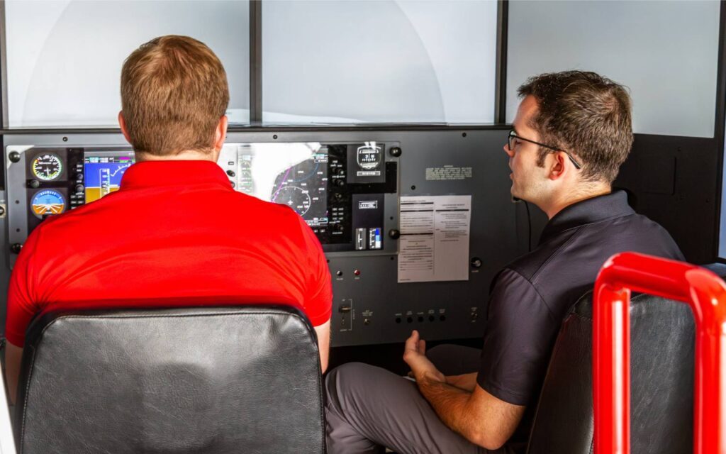 flight students practicing accelerated stalls in the simulator